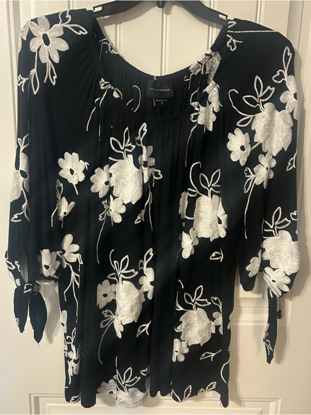 LIV LOS ANGELES Black Top with White Floral Embroidery and Tie Sleeves